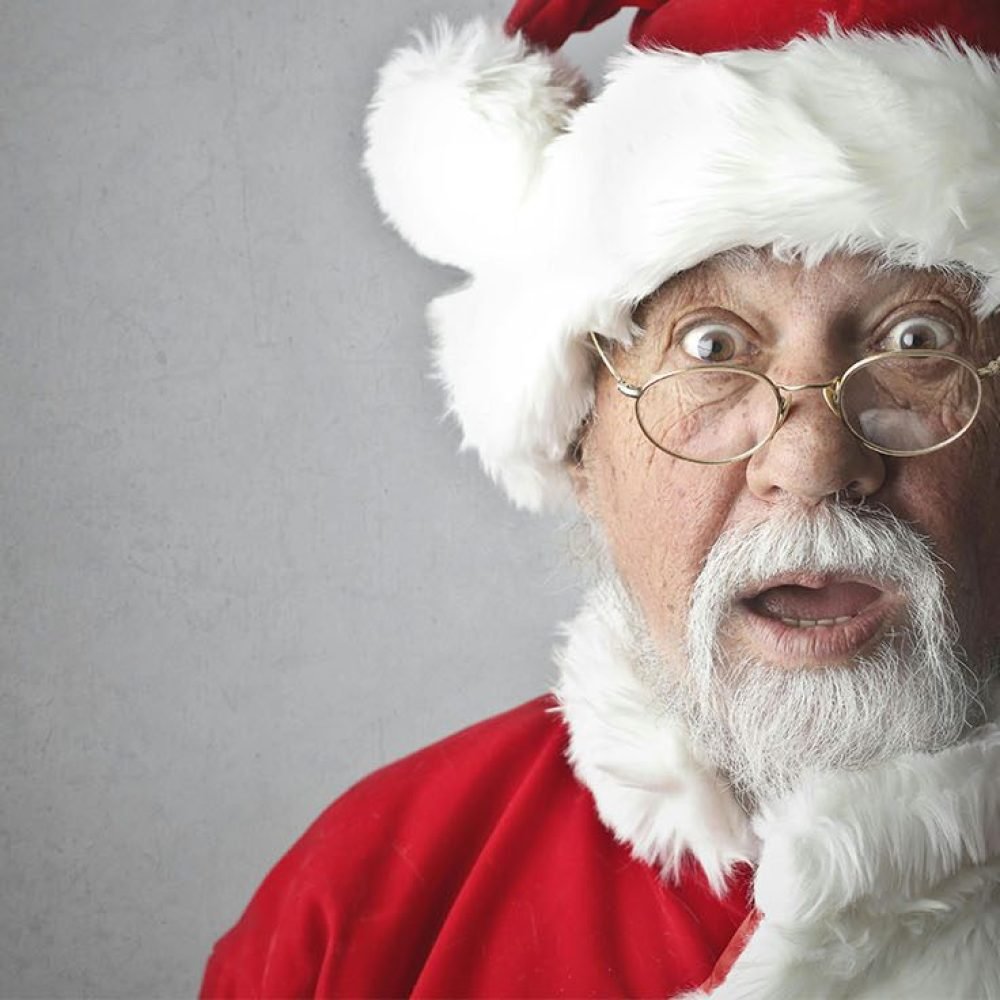 Santa Claus making a surprised festive expression